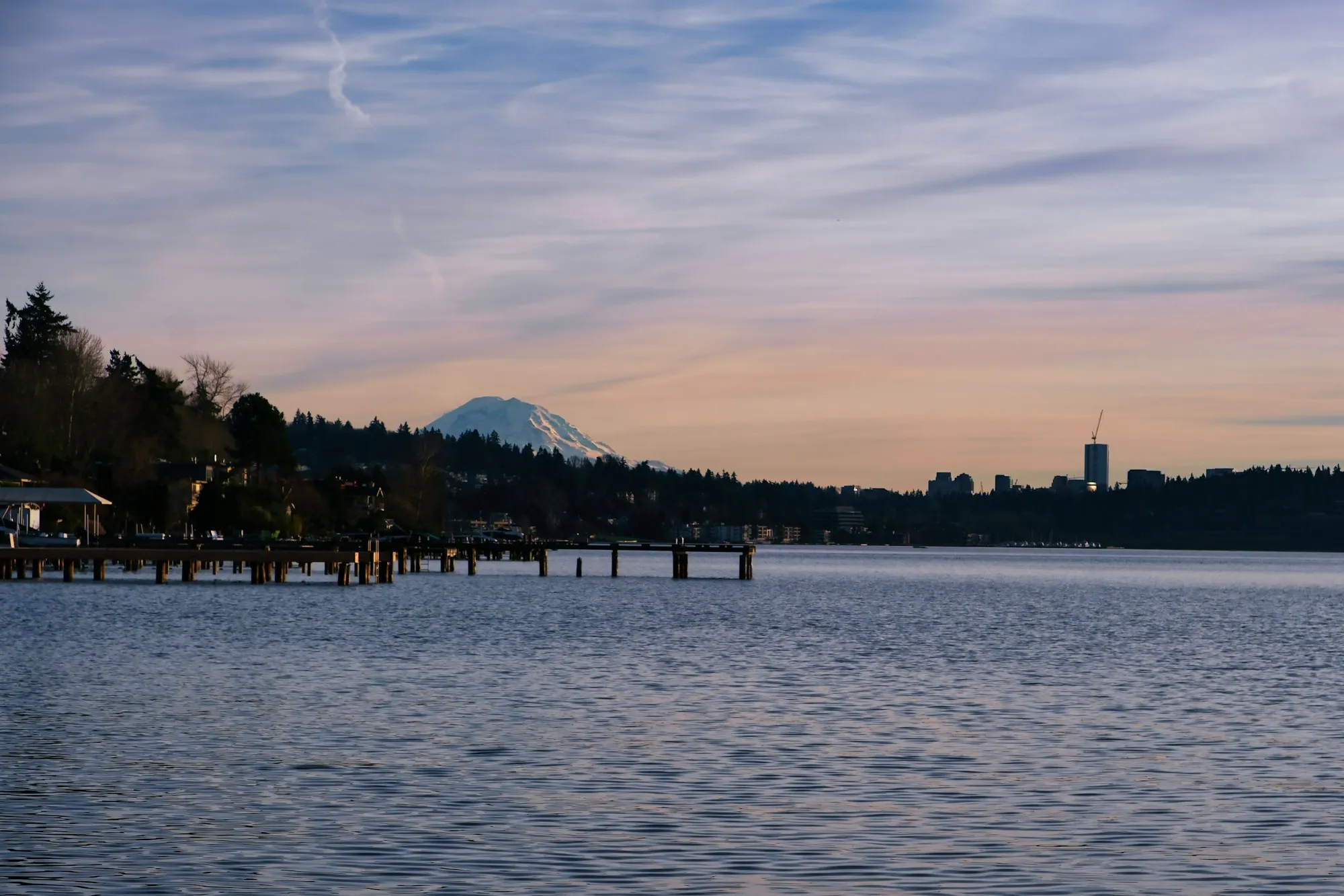 Lake Washington with a wooden pier and Mount Rainier in the distance